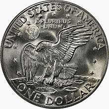 One side of a coin, depicting an eagle on the surface of the moon