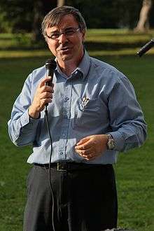 Anthony Vannelli, Dean of CPES, speaks into a microphone.