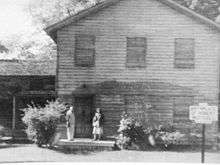 Arthur and Ruth Cromwell at house prior to 1954 Restoration