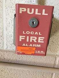  A Notifier pull station at Oklahoma State University.  The orange sticker on it warns would-be pranksters the consequences for false alarms.