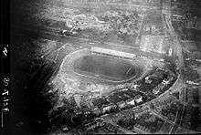 B&W photo of the stadium from the air