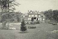 A shingled three-story house