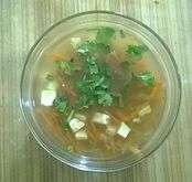 A broth-style carrot-papaya soup prepared using julienned carrots