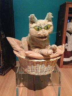 Hand puppet of a cat sitting in a basket