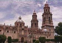 Large church with two main towers and two cuppolas.