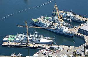 Aerial photograph of Canadian warships docked at Her Majesty's Canadian (HMC) Dockyard