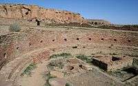 A color picture of a large ancient ruin in summer