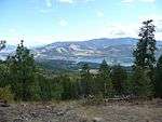 Colville National Forest with a lake and mountains.