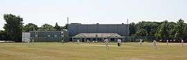 Cricket being played in front of the pavilion at Devonshire Park