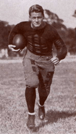 Football player charging toward the camera