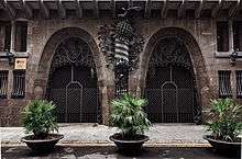 Two large, ornate entrance gates to a building