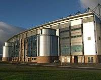 The front façade of a stadium building