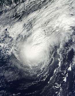 A visible satellite image of a disorganized hurricane on October 12.