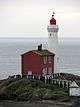 Exterior view of the Fisgard Lighthouse and the Pacific Ocean