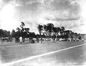 Football sailing over the goalposts