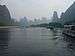 Tall karst mountains in the mist seen from the Li river