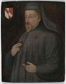 A man dressed in grey with a beard, holding a rosary, depicted next to a coat of arms.