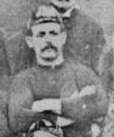 Black and white image of Williams wearing his cap posing before a match