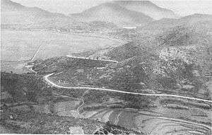 A mountain pass with a road running through it