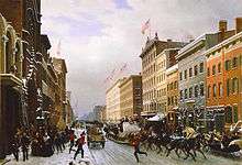 A painting of a snowy city street with horse-drawn sleds and a 19th-century fire truck under blue sky