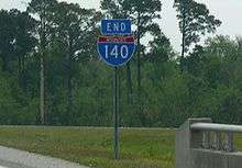 Interstate shield on a cloudy day.