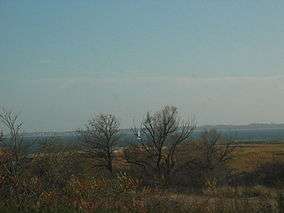 Flat land with open bay behind