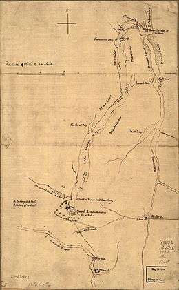 Fort Carillon is at the far northern end of the map, separated from Lake George by a short river with falls.  There is a road or path leading from the fort to the northern end of the lake, with a sawmill at the first crossing.  The map is labelled with mountains to either side of Lake George, which is long and narrow, extending about 3/4 the length of the map.  At its southern end the fort is shown, with the French camp to the northwest, and the camp of Indians and Canadians over the road leading south toward Fort Edward.  The latter is near the bottom of the map, on the Hudson River just below some falls.