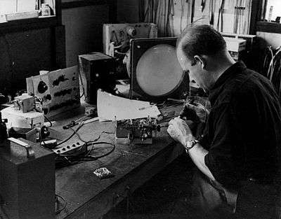 Keneth Alden Simons at his workbench in the 1950s