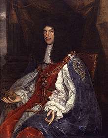 Painting of seated male figure, with long black hair wearing a white cape and breeches.