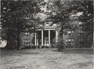 A brick, neoclassical hospital building.