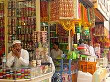 four men in a traditional bridalware shops in the market