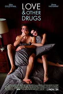 Jamie (Jake Gyllenhaal) and Maggie (Anne Hathaway) are in torn blankets in bed, as information is below and "Love & Other Drugs" is at the top.