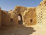 Ruins of a building made of unhewn stones.