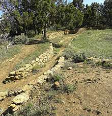 A color picture of a long masonry wall