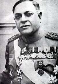 a black and white photograph of a male in dress uniform