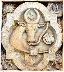 A coat-of-arms depicting the head of an aurochs with a crescent and a star over it