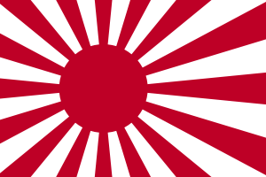 A flag bearing a stylised red sunburst symbol on a white background.