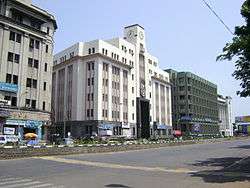 a multi-storeyed building, with road in the foreground