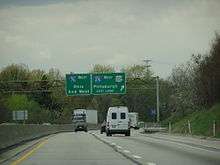 Cars and trucks on four-lane, divided highway