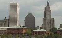 Three buildings, two of the same stature, and one smaller than the others