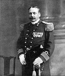 A mustachioed man in formal military dress, with shoulder boards and many medals