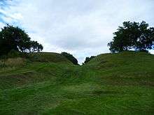 grass swale bisecting hill