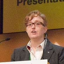 Photograph of Ruth Hunt standing at a podium.