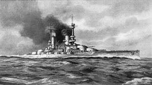 A large battleship sits motionless, black smoke billows from its funnels