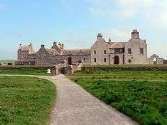 Scottish manor house with harling & crow-stepped gables