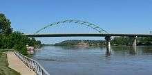 Bridge on high concrete pillars; two pillars connected by double arch