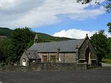 Small stone-built church in a graveyard