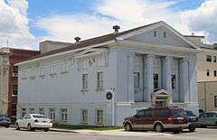 Photograph of the St. Maries Masonic Temple, a large, neoclassical building with a pillared and pedimented front