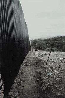 Steel barrier wall near Mariposa port of entry, Nogales, Sonora, Mexico. This view is from Sonora northeast, looking toward Arizona.