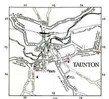 An old map showing the main roads and the river in the town.